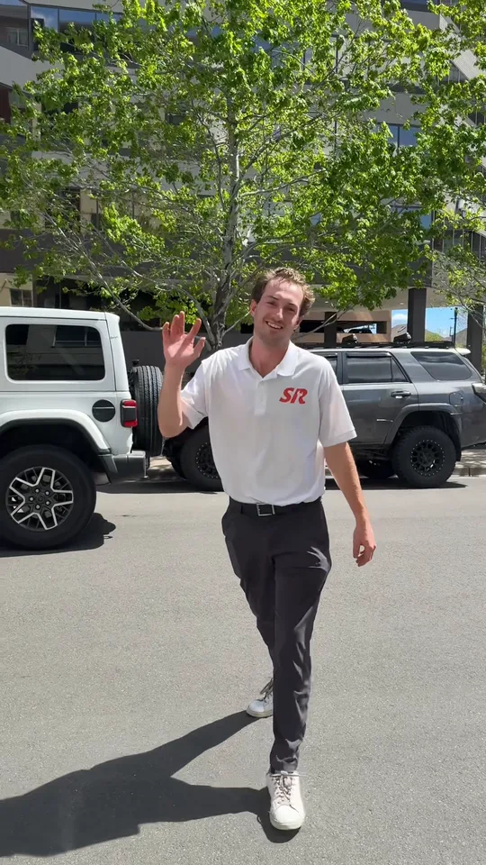 Cade Cushman waving before a Swerve vehicle pickup